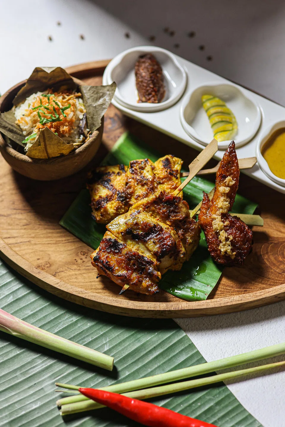 Madam Lee's lotus leaf rice is paired with marinated barbecued chicken.