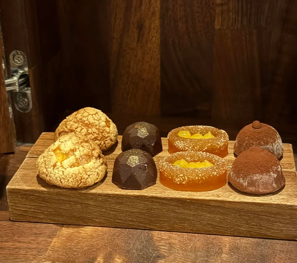 Petit fours include choux puffs, chocolates and fruit jellies.