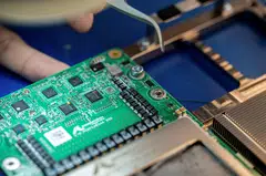 FILE PHOTO: Recently launched Amazon artificial intelligence processors that aim to tackle Nvidia and the chips made by the other hyperscalers such as Microsoft and Google are shown at an Amazon lab in Austin, Texas, U.S., July 19, 2024. REUTERS/Sergio Flores/File Photo