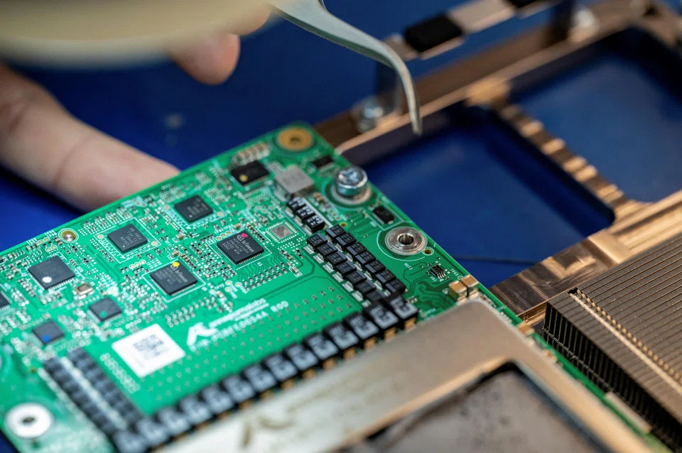 FILE PHOTO: Recently launched Amazon artificial intelligence processors that aim to tackle Nvidia and the chips made by the other hyperscalers such as Microsoft and Google are shown at an Amazon lab in Austin, Texas, U.S., July 19, 2024. REUTERS/Sergio Flores/File Photo