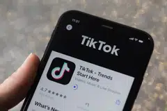 TikTok's downsized ambition reflects a pullback in marketing spending worldwide as companies and consumers tighten budgets and prepare to ride out a potential recession. 