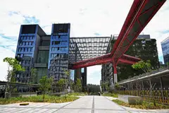 OCBC Punggol (left) is directly connected to SIT's Chua Thian Poh Discovery Hub via a red link bridge. 