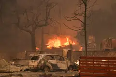Destruction caused by a wildfire in Altadena, California, Jan 8, 2025. Rampaging wildfires around Los Angeles have killed at least two people, officials said January 8 as terrifying blazes leveled whole streets, torching cars and houses in minutes.