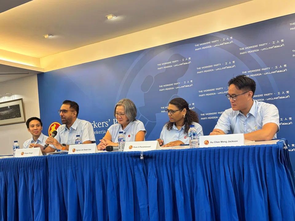 WP chief Pritam Singh (second from left) and chairman Sylvia Lim (centre) with three new candidates: Michael Thng (far left), Paris Parameswari (second from right) and Jackson Au.