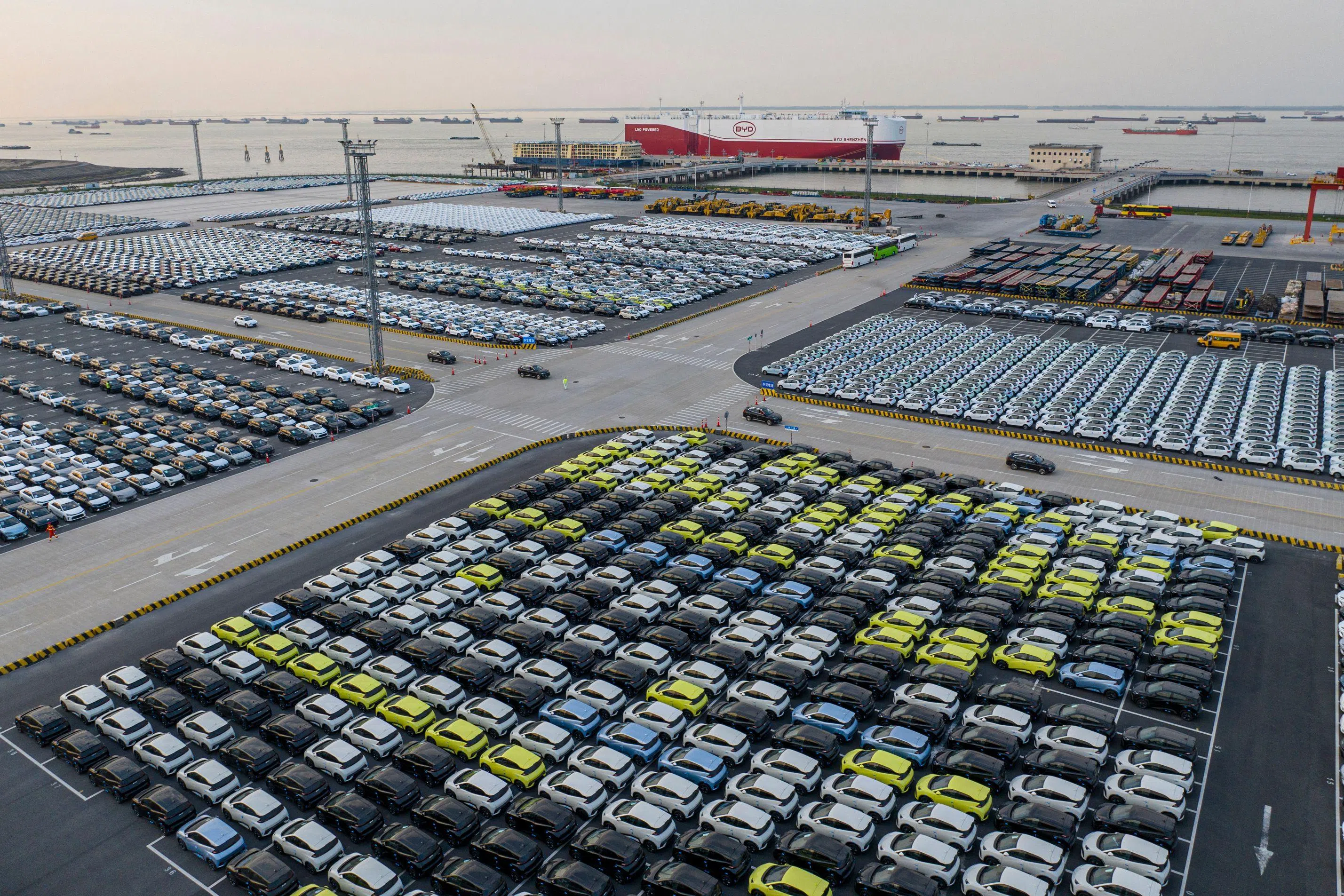 The photo taken on April 27, 2025 shows BYD electric cars waiting to be loaded to the automobile carrier BYD "Shenzhen", which will sail to Brazil from the Taicang Port in Suzhou, in China’s eastern Jiangsu province. (Photo by AFP) / China OUT
