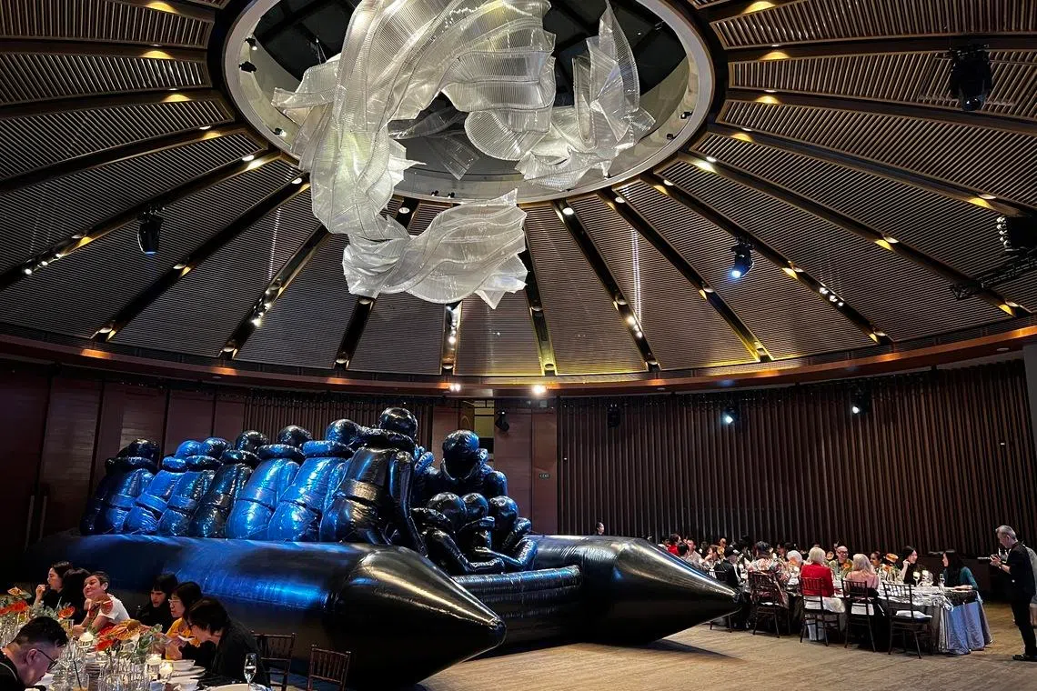 Ai Weiwei’s raft of refugees placed between diners at Capella Singapore.