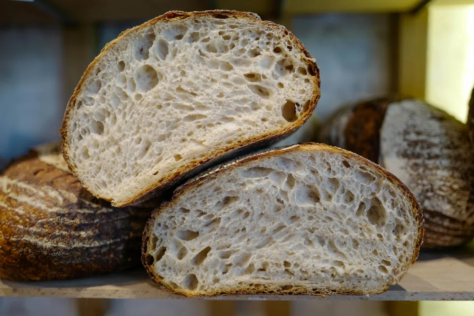Crusty sourdough is served with yuzu butter and olive oil.