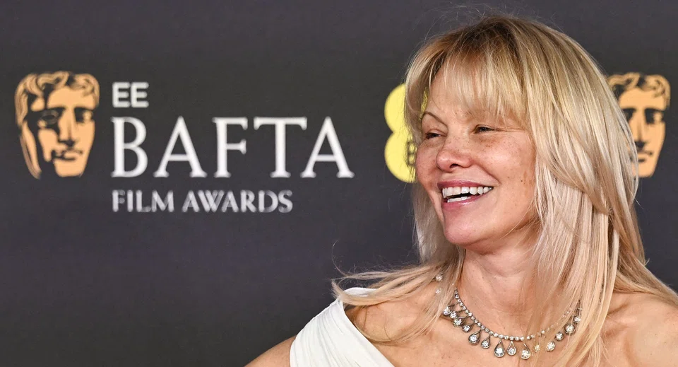 Actress Pamela Anderson poses on the red carpet upon arrival at the Bafta British Academy Film Awards in London, Britain, Feb 16, 2025. 