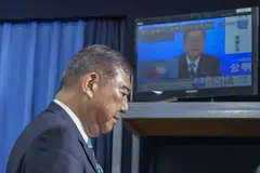 Ishiba says he will remain to oversee tariff talks with the US and other pressing matters, such as rising consumer prices.