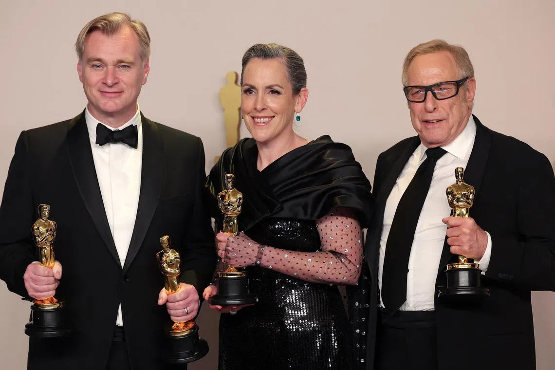 Christopher Nolan, Emma Thomas and Charles Roven pose with the Oscar for best picture for Oppenheimer at the 96th Academy Awards in Hollywood.