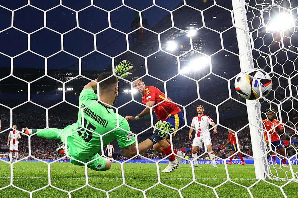 Spain's Fabian Ruiz scores the team's second goal against Georgia in Cologne, Germany, June 30, 2024.
