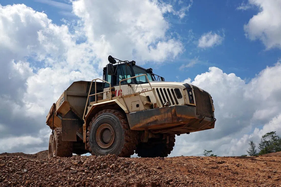 A truck passes through a tin mining area of Indonesia's PT Timah in Pemali, Bangka island, Indonesia, July 25, 2019. A number of tin executives were convicted for colluding to conduct illegal mining.