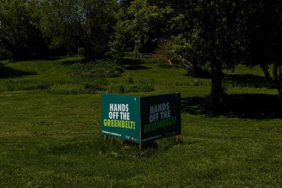 Protest signs are seen on a property in Duffins Rouge Agricultural Preserve, a part of the Ontario Green Belt in the Greater Toronto Area of Pickering, Ontario.