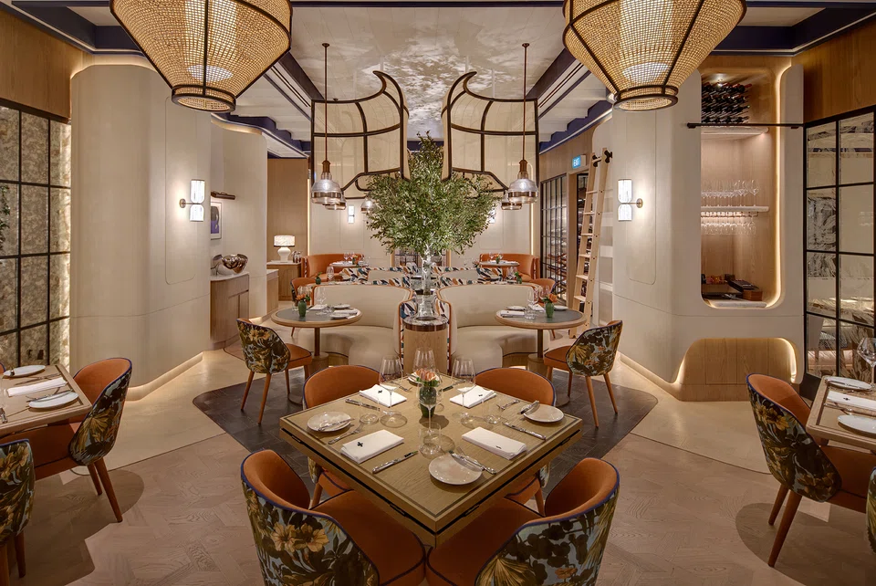 Maison Boulud features a double-storey space with an outdoor terrace.