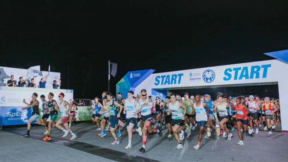 Thousands of runners of the Standard Chartered Singapore Marathon taking off at the start line of the Marathon category on Dec 1, 2024.