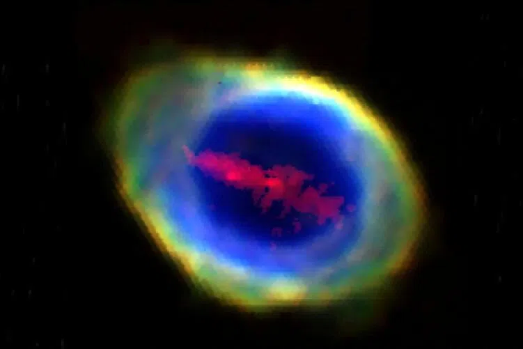Researchers have spotted a large cloud of iron atoms in the shape of a bar stretching about 6 trillion km long across the face of the Ring Nebula (top).