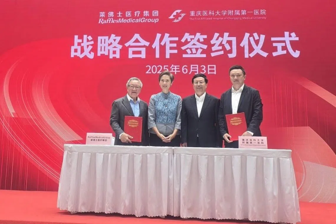 At the signing ceremony were (from left): Dr Loo Choon Yong, Raffles Medical Group executive chairman; Minister for Digital Development and Information Josephine Teo; Hu Henghua, mayor of Chongqing; and Wu Hao, the First Affiliated Hospital of Chongqing Municipality party committee secretary. 