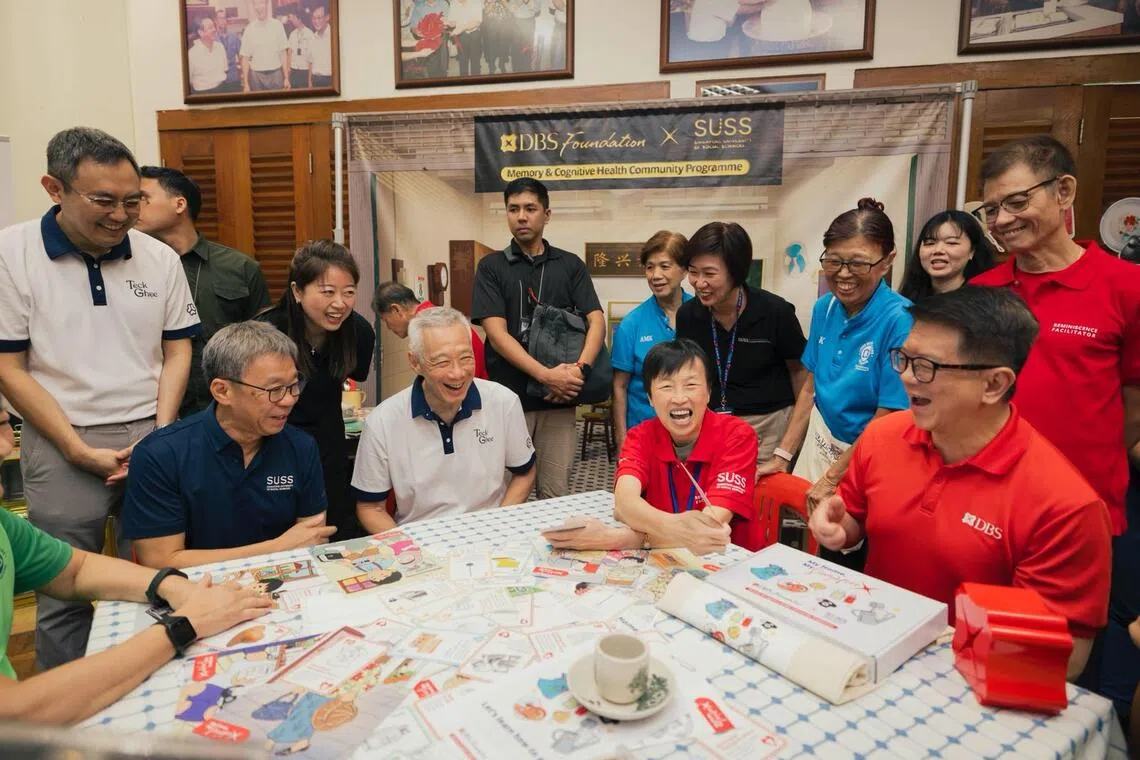 DBS Foundation's partnership with the Singapore University of Social Sciences aims to address cognitive decline among seniors. 

Pictured, from left to right: Professor Tan Tai Yong, SUSS President; Senior Minister Lee Hsien Loong; Mdm Gan, a trained facilitator from community partner Lions Befrienders; Lim Him Chuan, DBS Singapore country head.