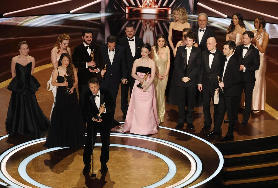 Director Sean Baker accepts the Oscar for Best Picture for "Anora" as producers Samantha Quan, Alex Coco, and Best Actress in a Leading Role winner Mikey Madison look on at the 97th Academy Awards in Los Angeles, California, March 2, 2025. 