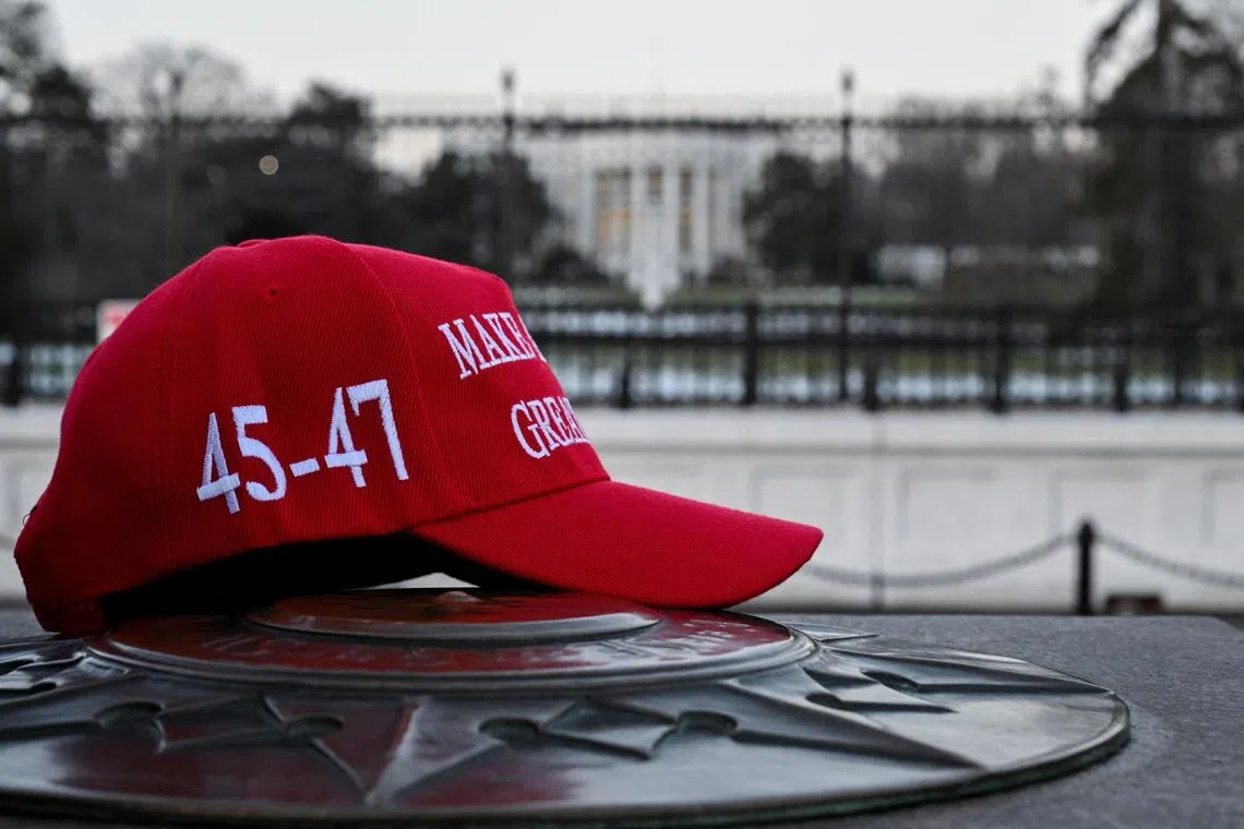 A "Make America Great Again" hat in front of the White House.