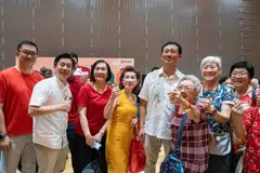 Minister Ong (4th from right), OCBC CEO Helen Wong (6th from right) and its head of global consumer financial services Sunny Quek (1st from left) with seniors at the launch of OCBC SeniorCare programme.