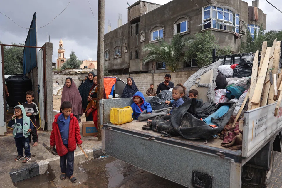 Displaced Palestinians in Rafah pack their belongings following an evacuation order by the Israeli army on May 6, amid the ongoing conflict between Israel and the Palestinian Hamas movement. 