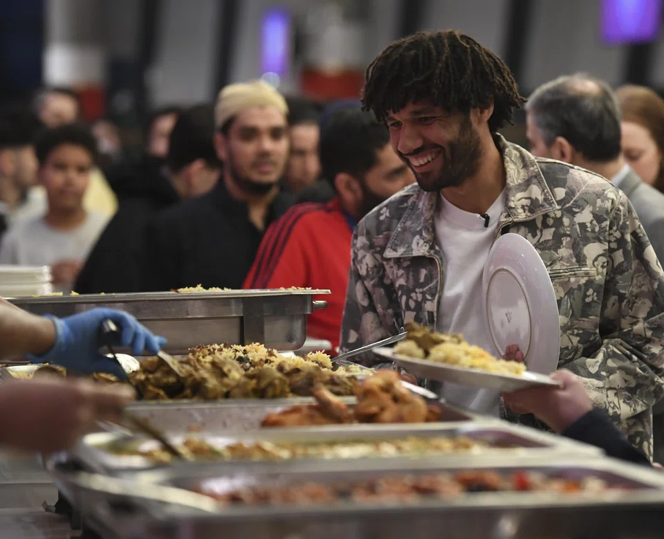 Arsenal midfielder Mohamed Elneny at a celebration of iftar, the evening meal to break the daily Ramadan fast, at the team's stadium in London on Mar 28.