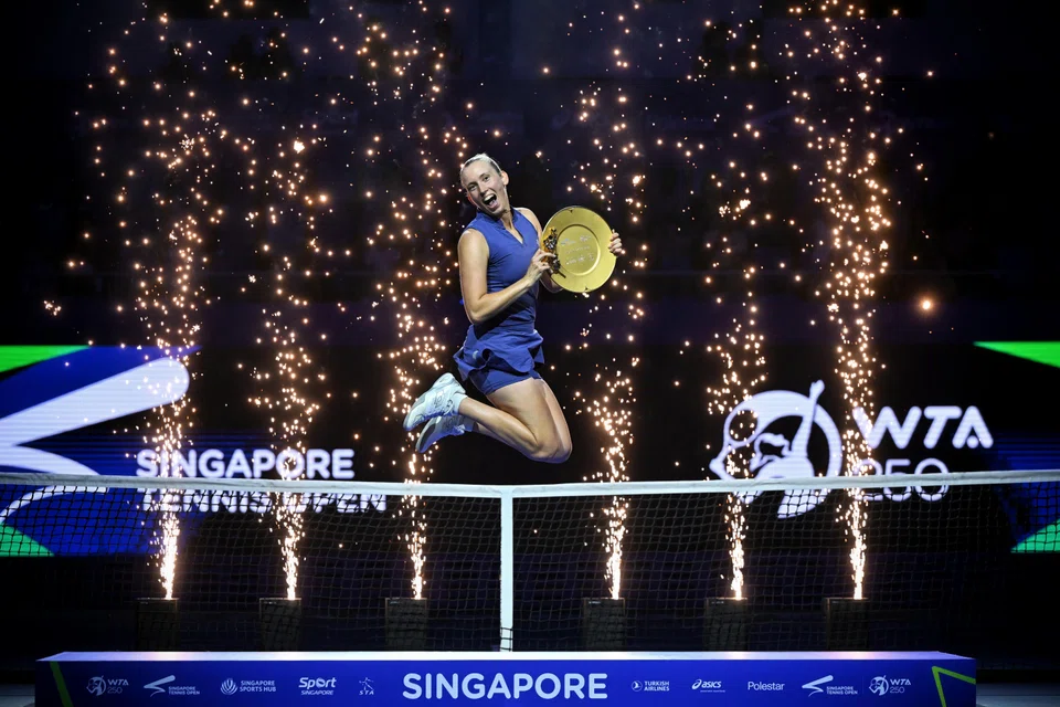 Elise Mertens shows her delight after bagging her ninth career singles title on the WTA Tour.