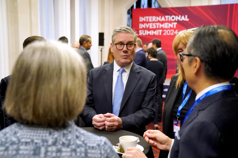 Prime Minister Keir Starmer speaking with attendees at the UK Investment Summit in London.