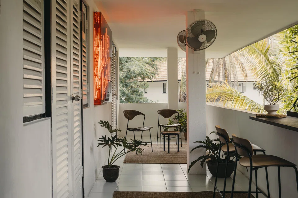 A generous roof overhang and electric fans make the verandah a pleasant space to linger in, even on hot days. 