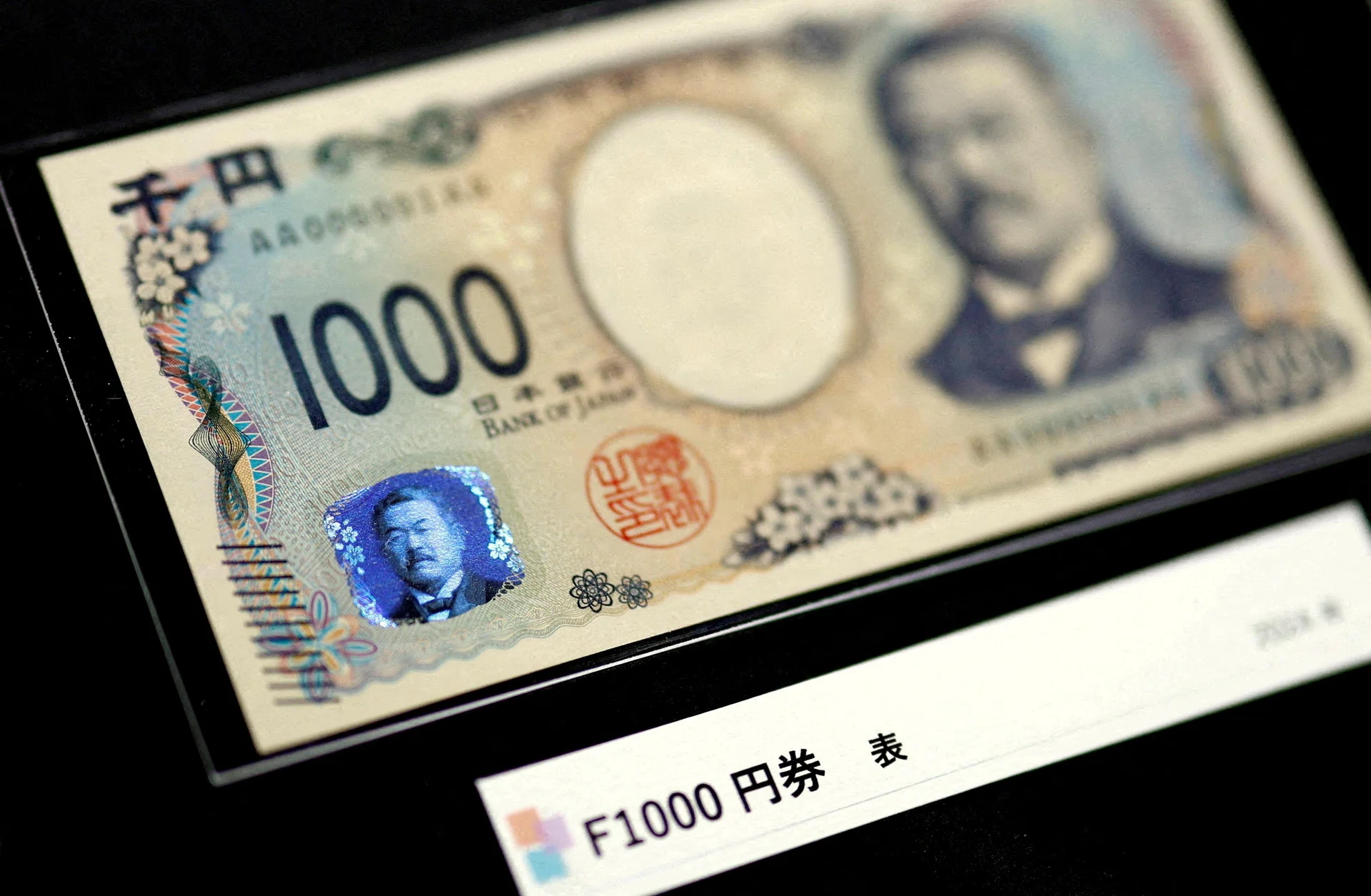 Yen extends declines after Bank of Japan hikes rates with two dissents