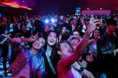 Revellers attend the first indoor showcase of electronic music festival 'The Magic of Tomorrowland' at the Hero Dome in Shanghai on Nov 22.