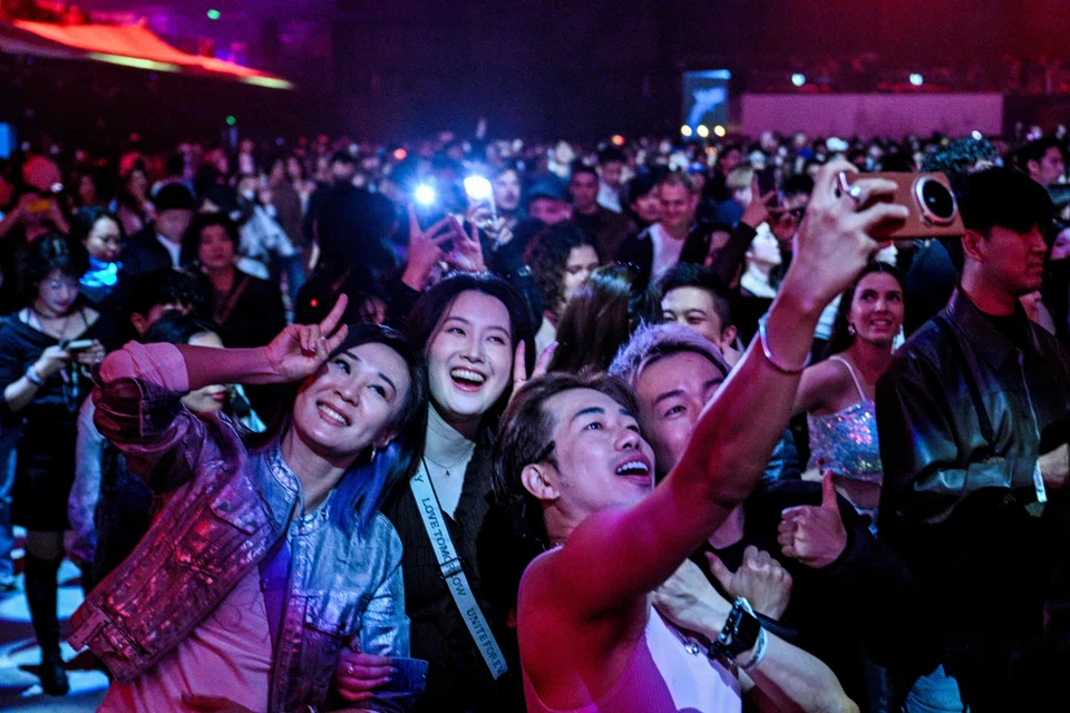 Revellers attend the first indoor showcase of electronic music festival 'The Magic of Tomorrowland' at the Hero Dome in Shanghai on Nov 22.