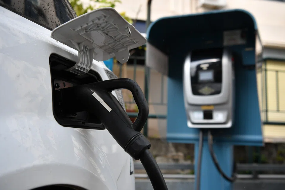 An electric vehicle (EV) being charged in Singapore. The rest of South-east Asia is expected to lag the Republic in EV adoption by 5 to 10 years.