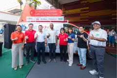 Minister Desmond Lee (third from left) at the e2i event at Boon Lay Community Club. Next to him (wearing white) is Hamid Razak, a fellow member of the PAP's West Coast-Jurong West GRC team.