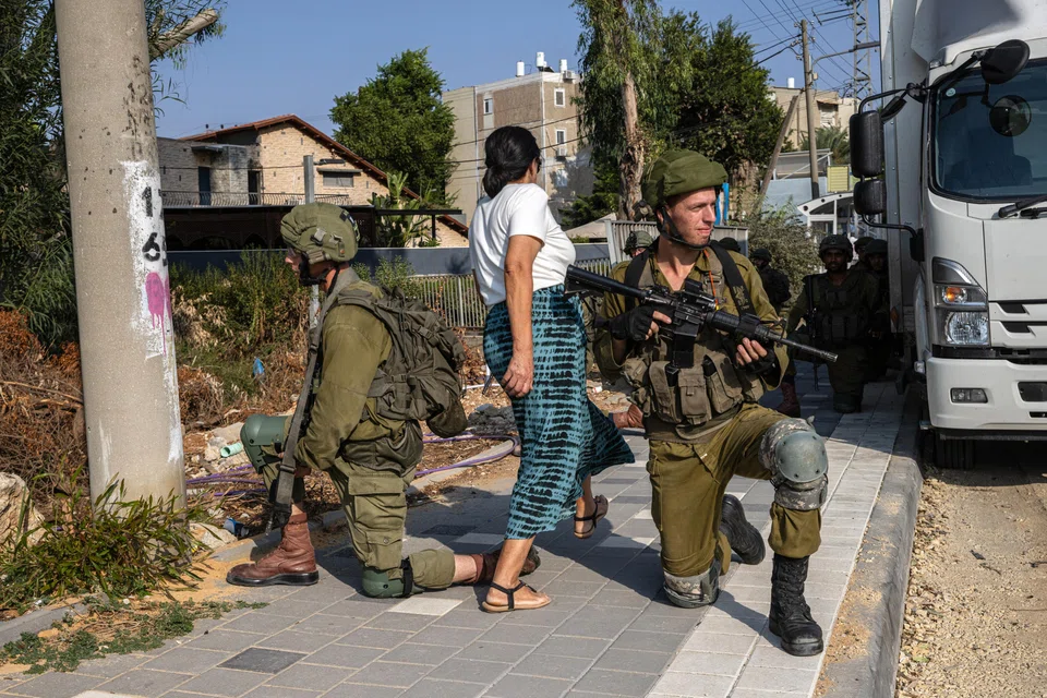 Israeli soldiers on guard in Sderot, Israel where Hamas gunmen attacked as part of a multi-faceted assault on Oct 8, 2023. Israel’s military is now on a war footing, with Prime Minister Benjamin Netanyahu having called an emergency meeting of security officials on Saturday.