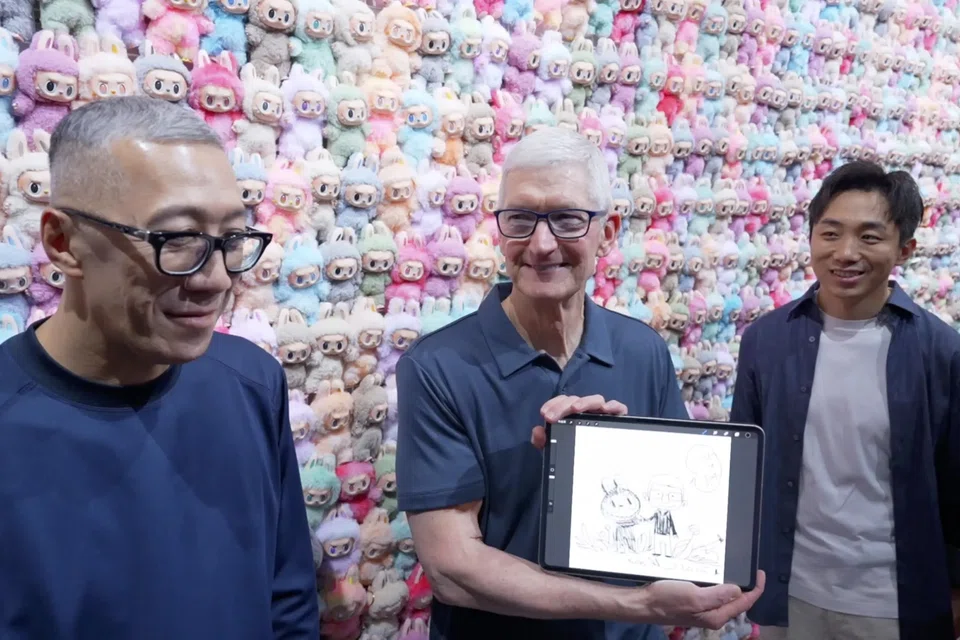 During his trip to China, Tim Cook met Labubu creator Kasing Lung (left) and Pop Mart founder Wang Ning (right).