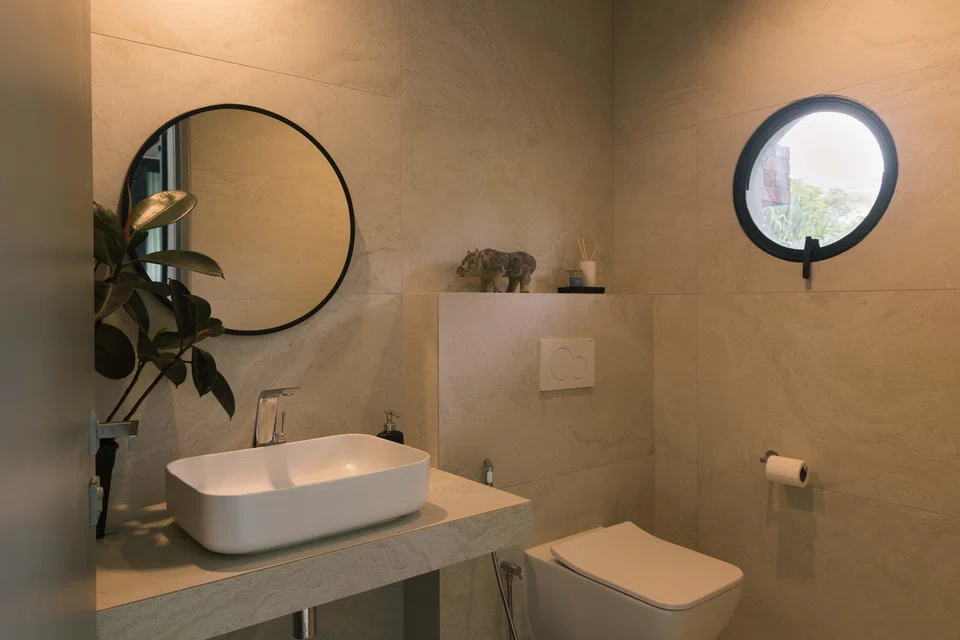 A playful element is portholes for bathroom windows, reminiscent of a ship or aircraft cabin.