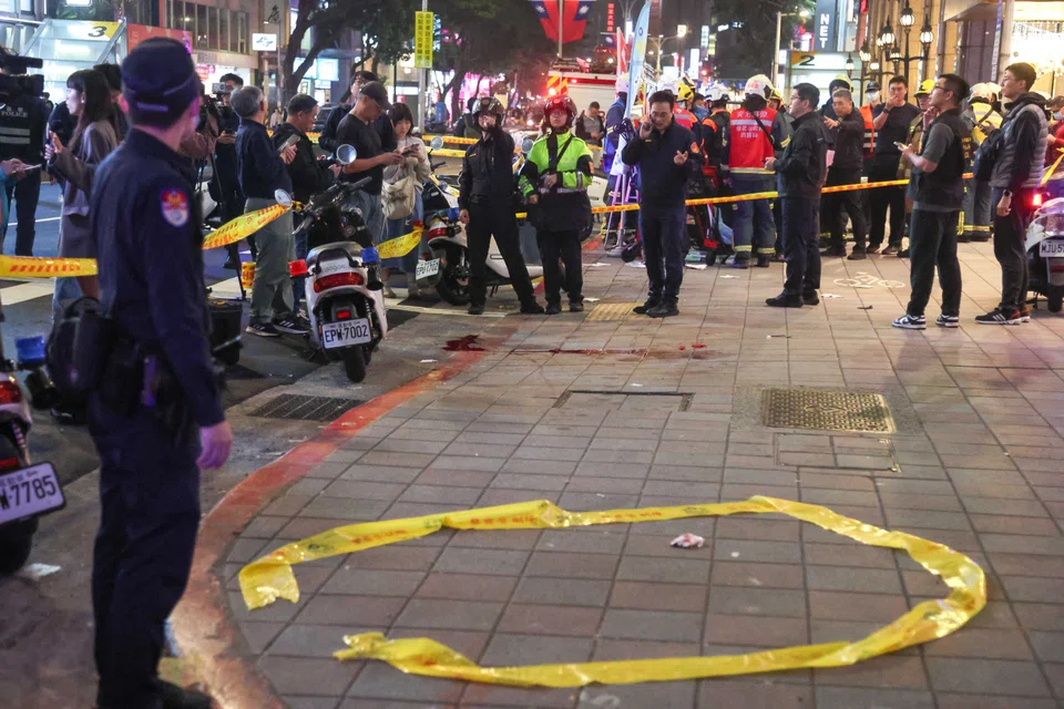 Police stand outside Eslite Spectrum Nanxi store near Zhongshan station, following an incident in which several people were injured after a man released smoke bombs and attacked bystanders, Taipei, Taiwan, Dec 19, 2025. 