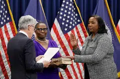 Lisa Cook (right) was sworn in as a member of the Fed's board of governors by Fed chair Jerome Powell (left) in Washington, DC in May 2022.