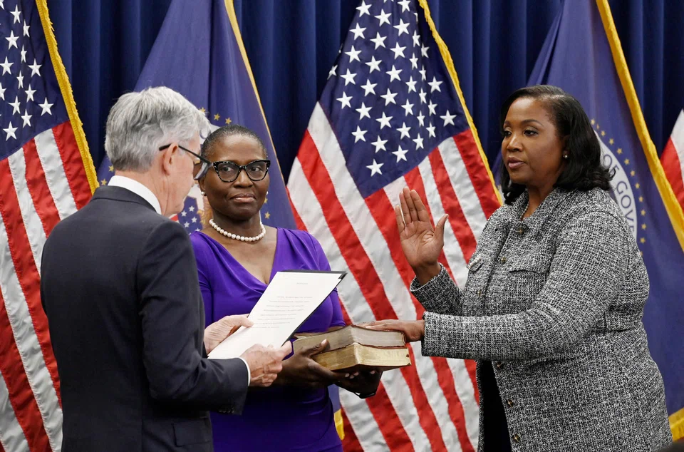 Lisa Cook (right) was sworn in as a member of the Fed's board of governors by Fed chair Jerome Powell (left) in Washington, DC in May 2022.