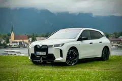After a facelift, the BMW iX still looks mostly the same, with its slab-sided body and carbon shell, but the grille now lights up and the headlights look a bit sharper.