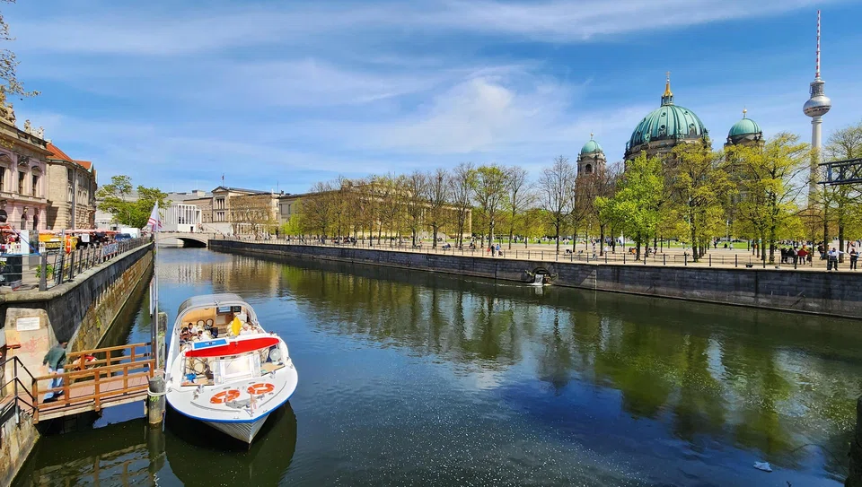 Berlin is linked by an extensive network of waterways. Museum Island buildings are at the far end, with Berlin Cathedral and the Berlin TV Tower on the right. 