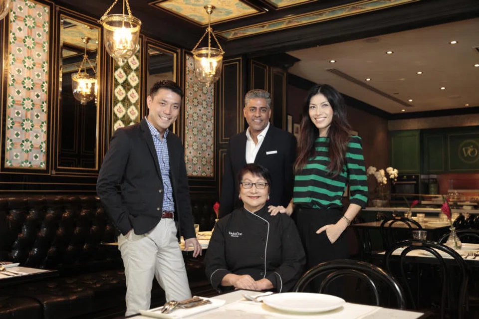 Restaurateur Violet Oon (seated) with (from left) her son Tay Yiming, business partner Manoj Murjani and daughter Tay Su-Lyn, in a photo from 2018, before the dispute arose.