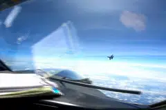 A screen grab taken from video from May 26, 2023 show a J-16 fighter pilot from China flying in front of the nose of a US Air Force RC-135 aircraft over the South China Sea in international airspace.