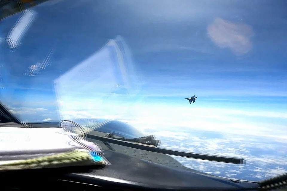 A screen grab taken from video from May 26, 2023 show a J-16 fighter pilot from China flying in front of the nose of a US Air Force RC-135 aircraft over the South China Sea in international airspace.