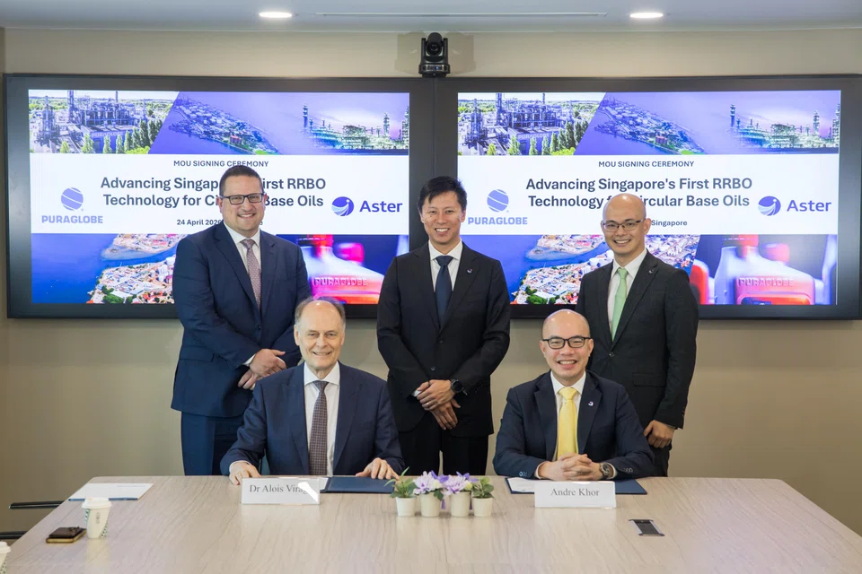 Puraglobe CEO Dr Alois Virag (front row, left) and Aster deputy CEO Andre Khor at the signing of an agreement between the two companies to jointly explore the development of an RRBO facility in Singapore.