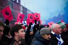 Everton's supporters protest over the club's 10-point deduction for breaching financial regulations, prior to the English Premier League football match between Everton and Manchester United at Goodison Park in Liverpool, north west England on Nov 26, 2023. 