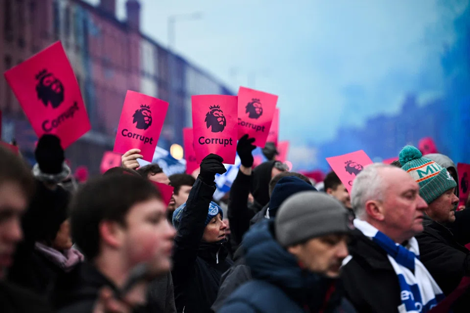 Everton's supporters protest over the club's 10-point deduction for breaching financial regulations, prior to the English Premier League football match between Everton and Manchester United at Goodison Park in Liverpool, north west England on Nov 26, 2023. 
