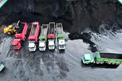 Coal used in power plants is loaded on to trucks at the coal storage facility at the port in Lianyungang, in China’s eastern Jiangsu province.